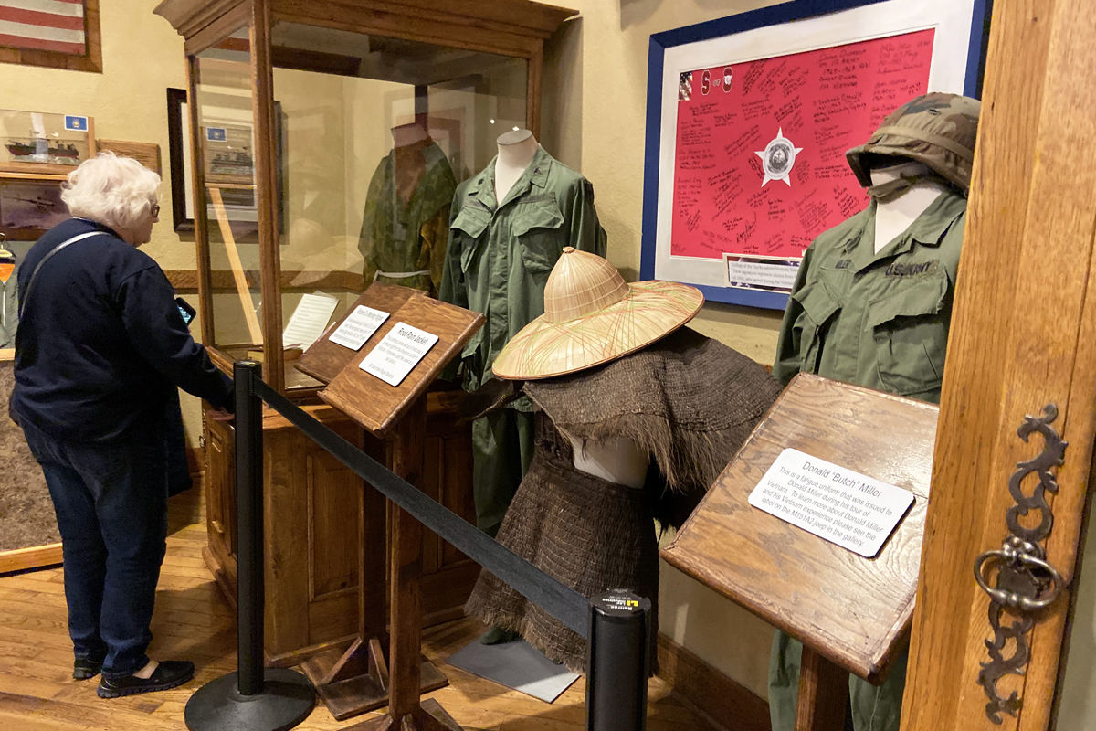 006 Gloria Joy viewed the uniforms and other items from the Vietnam era.jpg